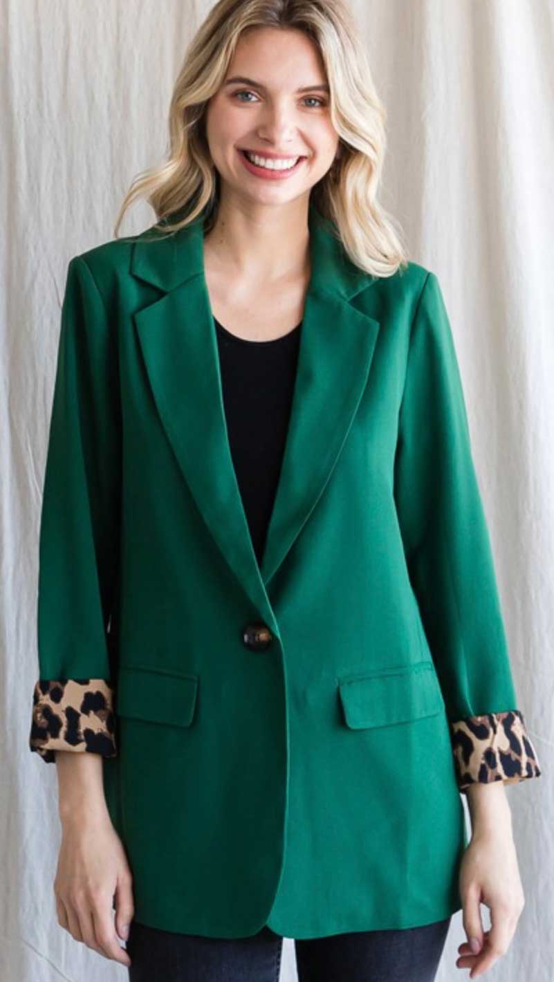 Long sleeves and front pockets, single button front