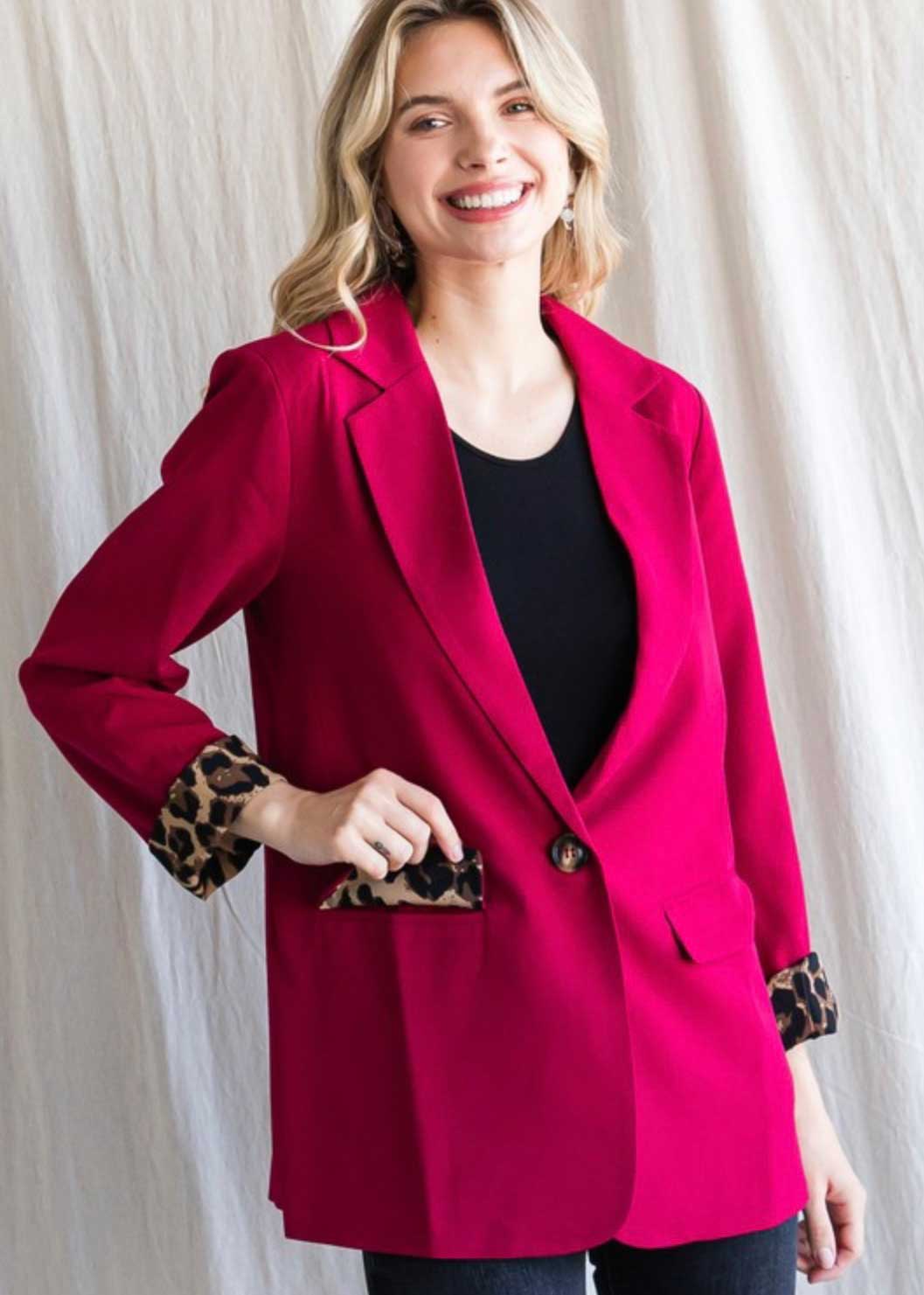 Long sleeves and front pockets, single button front